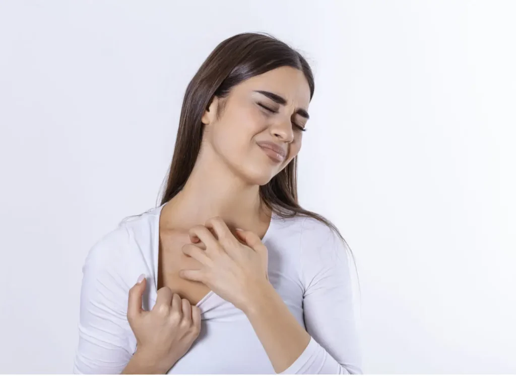 young woman scratching her neck due itching gray background female has itching neck concept allergy symptoms healthcare 1320x961.jpg